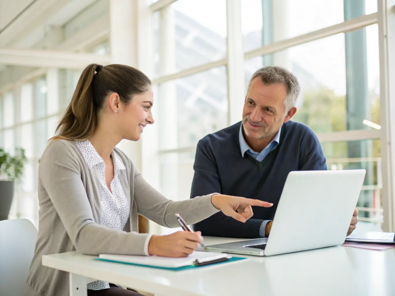 A private business skills lesson taking place in a professional office environment. The instructor is explaining a business concept using a whiteboard, while the student takes notes.